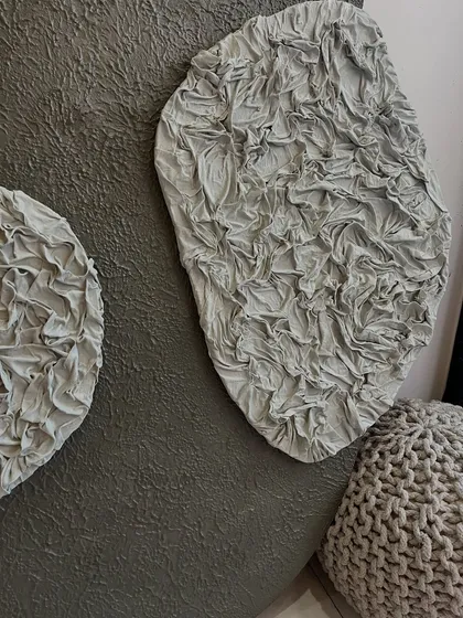 A close-up of the ruffled texture. This effect is created by meticulously sculpting fabric onto the board before painting, resulting in a unique and highly detailed 3D element.