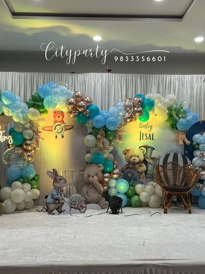 A bright, well-lit view of the teddy bear themed naming ceremony stage decoration.