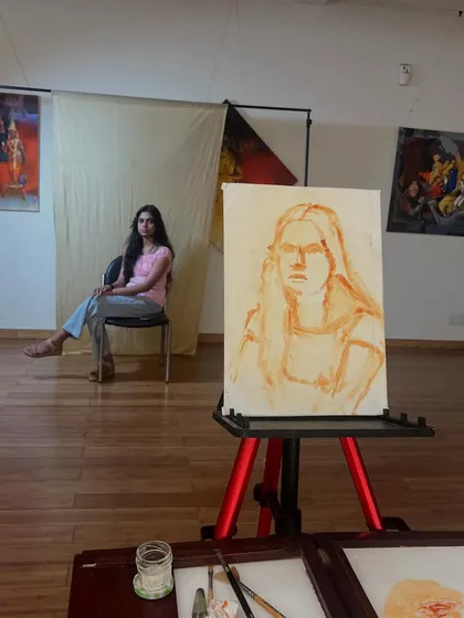 The very beginning of Simran's portrait, with the initial sketch on a toned canvas. This is the first step in mapping out the composition and proportions from life.