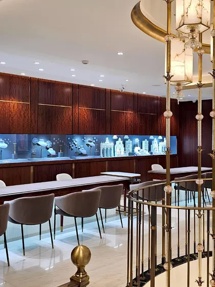 A cascading light installation crafted from alabaster and brass serves as the central anchor for the three-story Talwarsons flagship store in Chandigarh. This feature ties all levels together with a sense of quiet, vertical continuity.