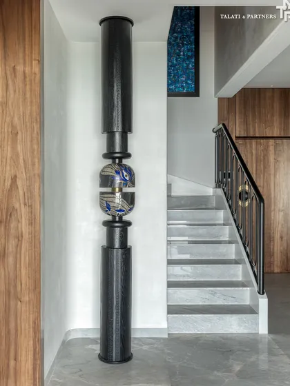 A detail from our "Nostalgia by the Sea" project, showcasing a sculptural art piece that intertwines with the staircase. The design is a love letter to tradition, evoking cherished memories while embracing contemporary comforts.