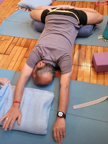 A restorative pose on a bolster.