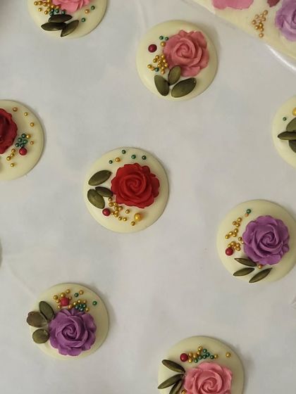 Each chocolate piece is crafted with so much care. You can see the detail in the little roses and the placement of each seed and sprinkle. It's all about making something special for you.