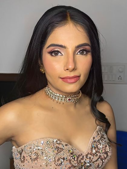 A breathtaking portrait of this bride, her makeup glamorous and her expression confident.