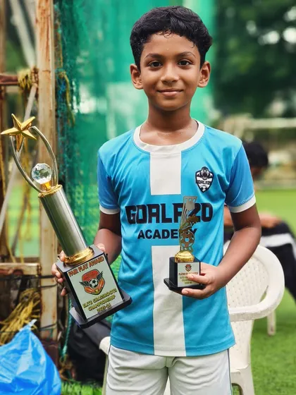 A proud moment for Swayam, holding his Player of the Match trophy and the team's Fair Play Award from the Elite Grassroots Championship.
