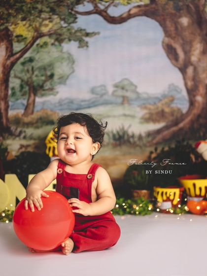 Another adorable shot from the Winnie the Pooh first birthday session. The classic theme and happy baby make for perfect portraits.
