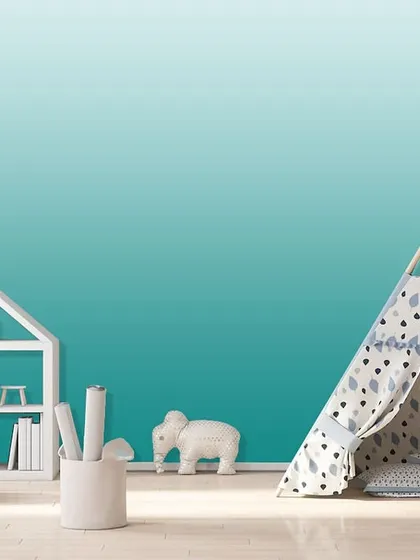 A smooth teal ombre effect in a kid's room, creating a serene and imaginative backdrop for play and rest. The color is both calming and stimulating.