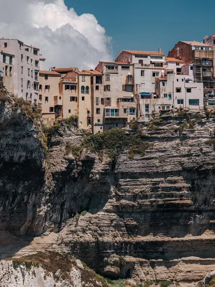 The dramatic cliffside architecture of Bonifacio, Corsica. This image captures the grand scale and unique character of a destination, showcasing how I frame landscapes to feel both epic and intimate.