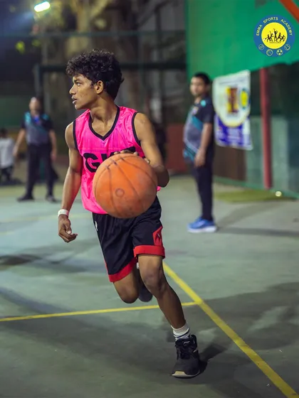 A player dribbles with intensity during a tournament game. The competitive environment at my academy pushes everyone to be their best.