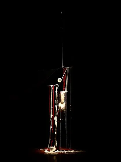 The full set for "Medea" under stage lights.