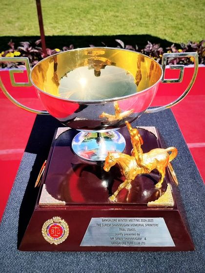 The Suresh Shanmugam Memorial Sprinter's Trial Stakes trophy, featuring a jockey and horse figurine.