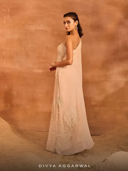 The back of the Talia Kurti Set, showing the elegant one-shoulder design and the intricate floral motifs that adorn the pants.