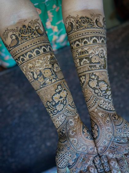 A beautiful example of a traditional bridal mehendi featuring doli (palanquin) and elephant motifs, symbolizing the wedding procession.