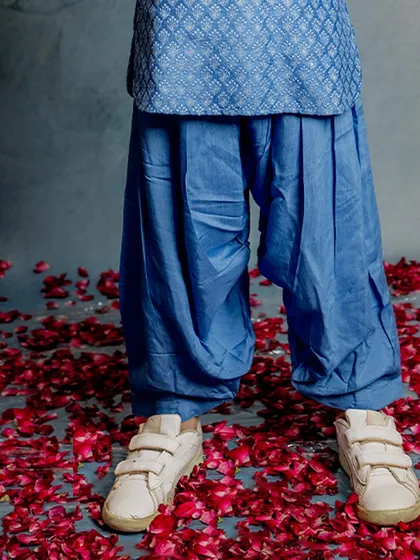 A close-up of our blue Patiala pants. The soft, breathable fabric and comfortable design make them perfect for active boys who love to run and play.