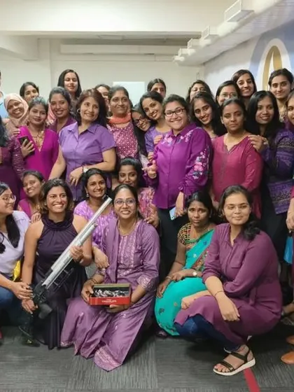 The entire team celebrating a fun and unique Women's Day experience at the Elite Shooting Club.