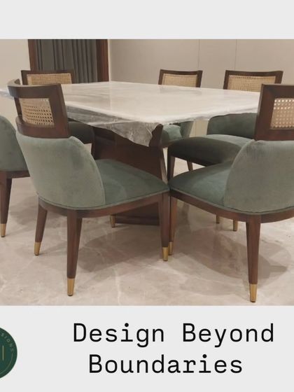 We designed this dining set with chairs that combine green velvet upholstery and woven cane backs. Paired with a marble-topped table, this set is a perfect example of our ability to mix materials and styles for a unique look.