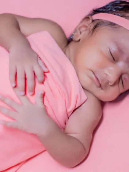 A serene portrait of a sleeping newborn. My sessions are always calm and un-rushed, allowing plenty of time for your baby to settle into a deep sleep for these perfect shots.