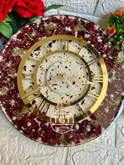 This image provides a clear, top-down view of the clock's design, highlighting the contrast between the floral border and the clean center.