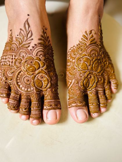 A detailed floral design for the feet, created for a client who loved her hand mehendi so much she wanted more.