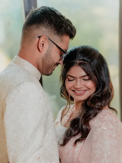A candid moment of joy from an engagement ceremony. Her makeup is soft and pretty, with a focus on a dewy finish that catches the light beautifully.