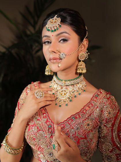 A confident and stunning portrait of a wedding guest. The makeup is bold and beautiful, perfectly complementing her traditional attire.