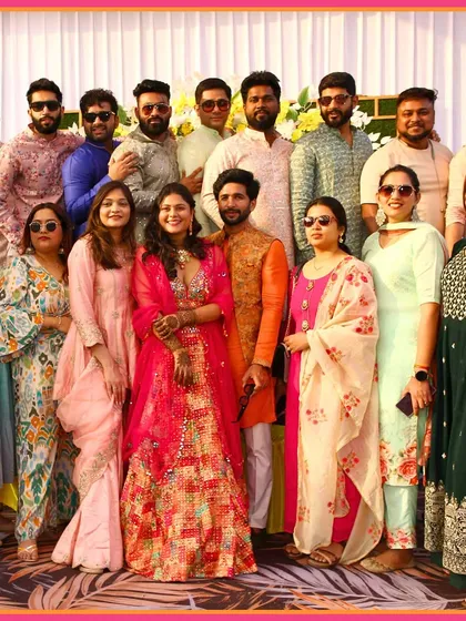 The couple surrounded by their entire squad. These group photos are cherished memories from the pre-wedding festivities.