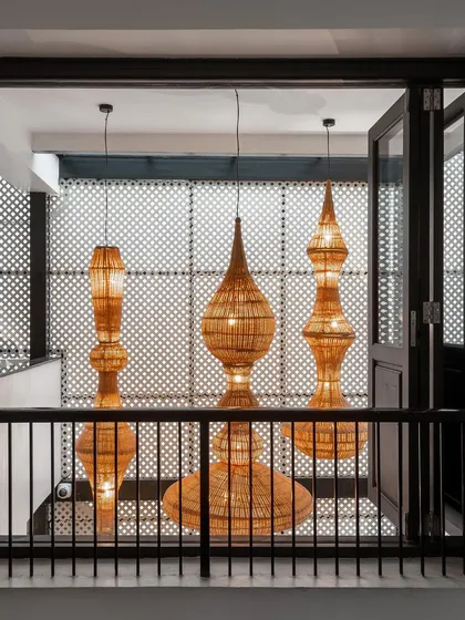 These large, sculptural pendant lights are made from cane by our collaborators at Bamboopecker. They serve as a stunning focal point in a double-height space, showcasing the beauty of natural, sustainable materials.