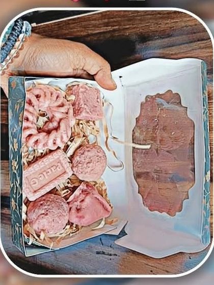 This image shows a creative way to use my gift boxes. It's filled with various soap shapes and shredded paper filler to create a beautiful and professional-looking gift set.