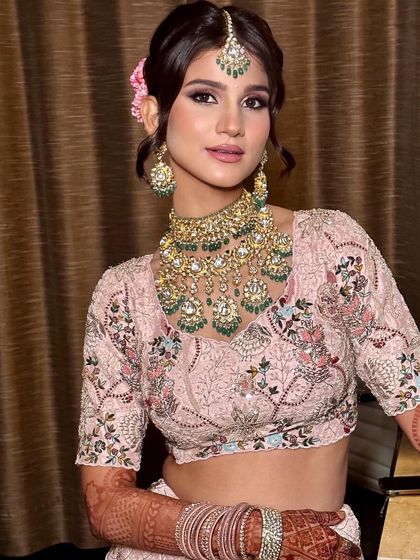 A close-up of the summer bridal look. The makeup is kept fresh and dewy, with a focus on enhancing her youthful features and creating a radiant glow.