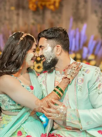 A joyful moment from a Haldi ceremony, where our floral dupatta adds to the festive atmosphere.