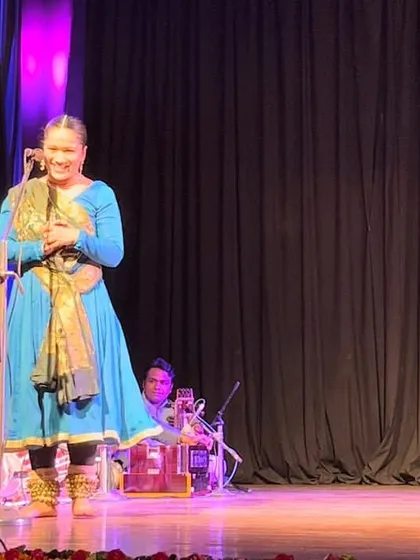 The dancer interacting with the musicians during her performance.