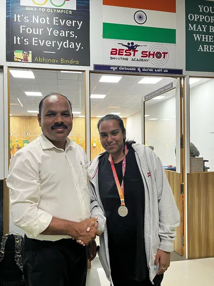 Hrudya with her silver medal, being congratulated by me at the academy.