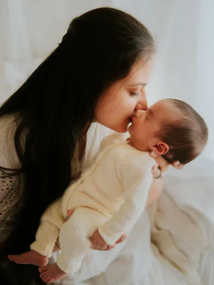 A mother's kiss, a newborn's peaceful rest. These are the quiet, heartfelt moments that mean everything. My newborn lifestyle sessions focus on the natural connection between you and your baby.