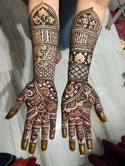 This is an example of my intricate, full-coverage bridal art. Notice the clean lines in the jaal (net) patterns, the delicate shading in the lotus flowers, and the symmetrical bands that create a rich, traditional look.