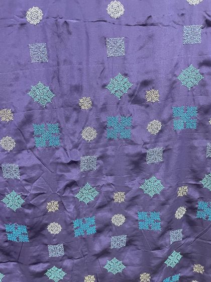 A closer look at the different Kasuti motifs on the navy blue crepe silk saree. Even with a traditional stitch, the arrangement and color palette can feel completely fresh and modern.