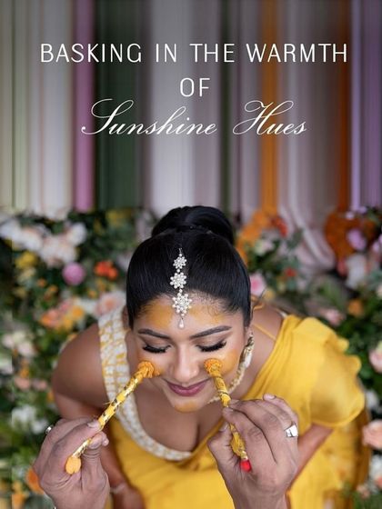 Basking in the warmth of sunshine hues. This playful shot captures the essence of the Haldi ceremony, a ritual of blessings and fun.