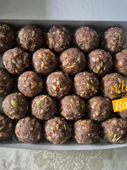 A box of Ragi or Nachni Laddoos. They are sweetened with jaggery and dates, making them a healthy, sugar-free option.