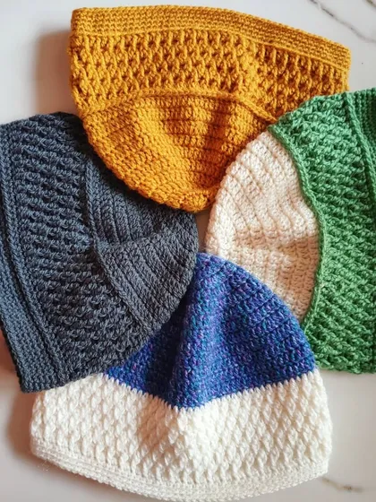 A handmade beanie is often one of the first projects for a new crocheter. This collection shows the variety of textures and styles you can learn, from the ribbed Alpine stitch to simpler designs, all perfect for gifting or keeping warm.