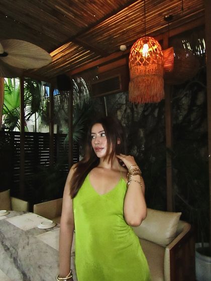 Another look at the green halter dress, a great choice for standing out.