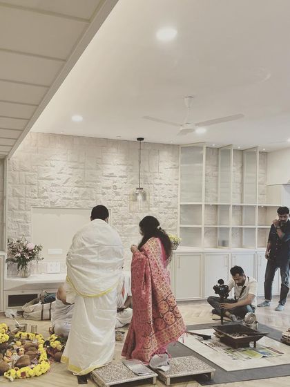 A housewarming ceremony in progress. Seeing our clients begin their new life in a space we created is the most rewarding part of our work.