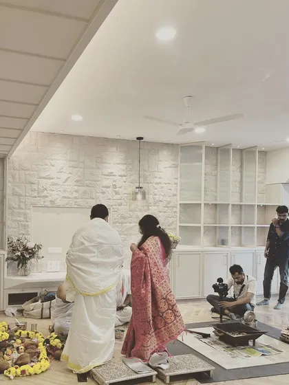 A housewarming ceremony in progress. Seeing our clients begin their new life in a space we created is the most rewarding part of our work.