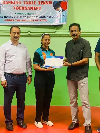 Sahana H M receiving her certificate for being the U17 Girls Runner-Up at the MSR State Ranking Tournament.