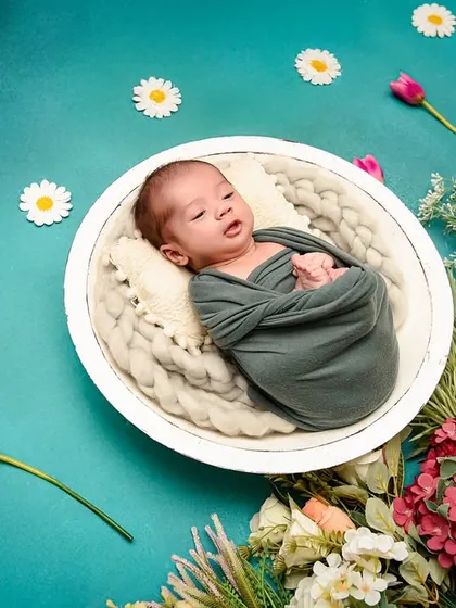 Another shot of the awake baby in the floral basket, capturing a different expression. I always take time to get a variety of shots during the session.