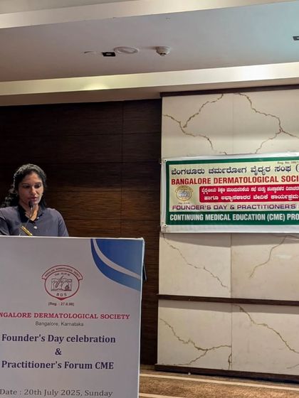 Speaking from the podium at the Practitioner's Forum CME. My goal is to bridge the gap between complex medical research and practical, effective treatments for my patients.