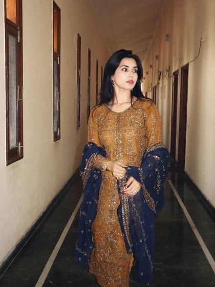 Another angle of the Asim Jofa suit, capturing a natural look-away pose that feels authentic and less staged.