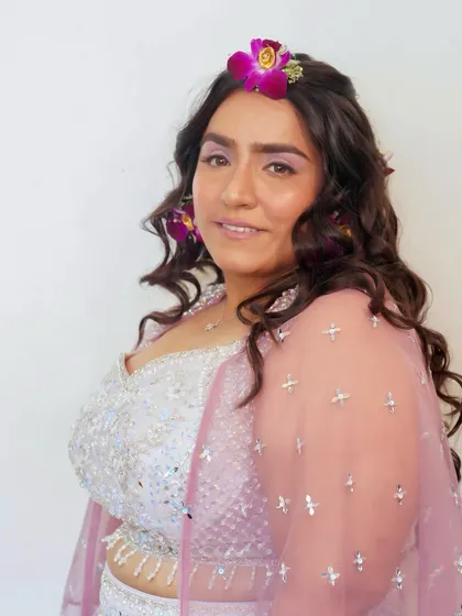 A three-quarter profile of the Haldi bride. The look is fresh, youthful, and glowing, exactly what you want for this happy occasion.