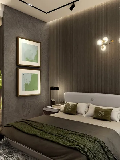 In the serene neighborhood of Walkeshwar, this bedroom redefines modern luxury with a nod to classical elegance. A dark, textured wall panel behind the bed is complemented by a modern branching light fixture and framed art, creating a strikingly minimal aesthetic.