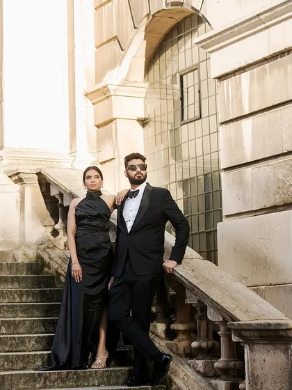 For a touch of formal elegance, we styled the couple in all-black against London's grand architecture. Her halter-neck gown and his classic tuxedo create a powerful, sophisticated statement.