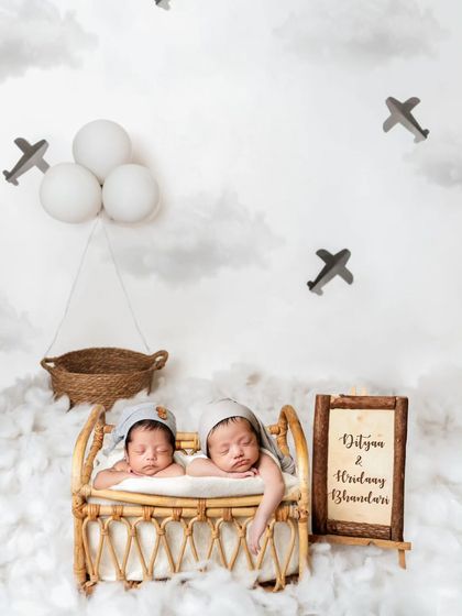 These twin wanderers are ready for an adventure in the clouds! This imaginative travel theme uses a tiny bed, clouds, and airplanes to create a magical world for them.