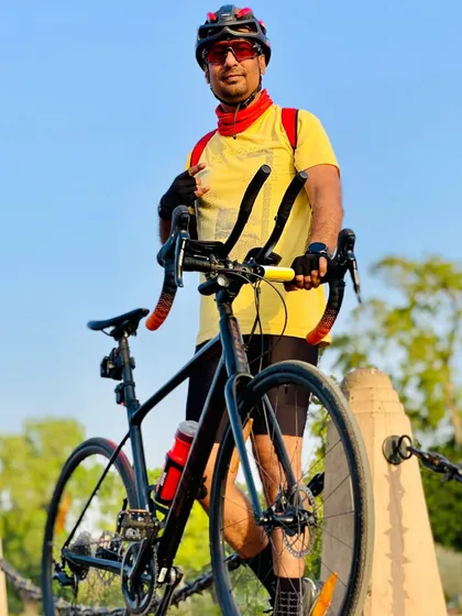Posing with a professional-grade bike. We have members who are serious about their equipment and performance.